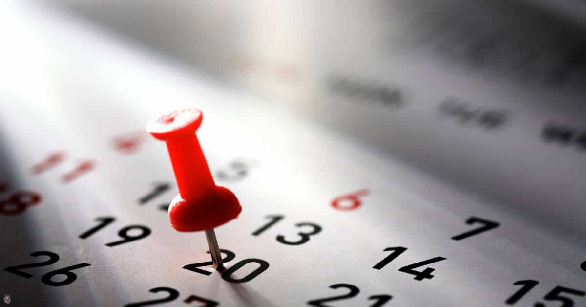 calendar with push pin selecting which days to build the website